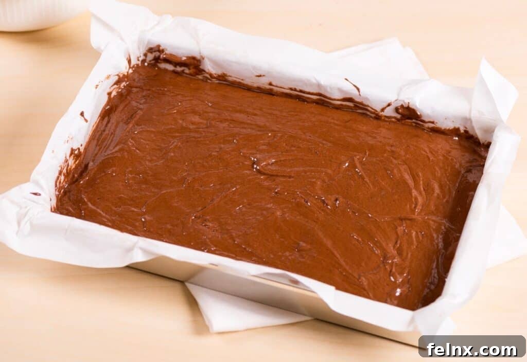 Smoothing brownie batter in a pan