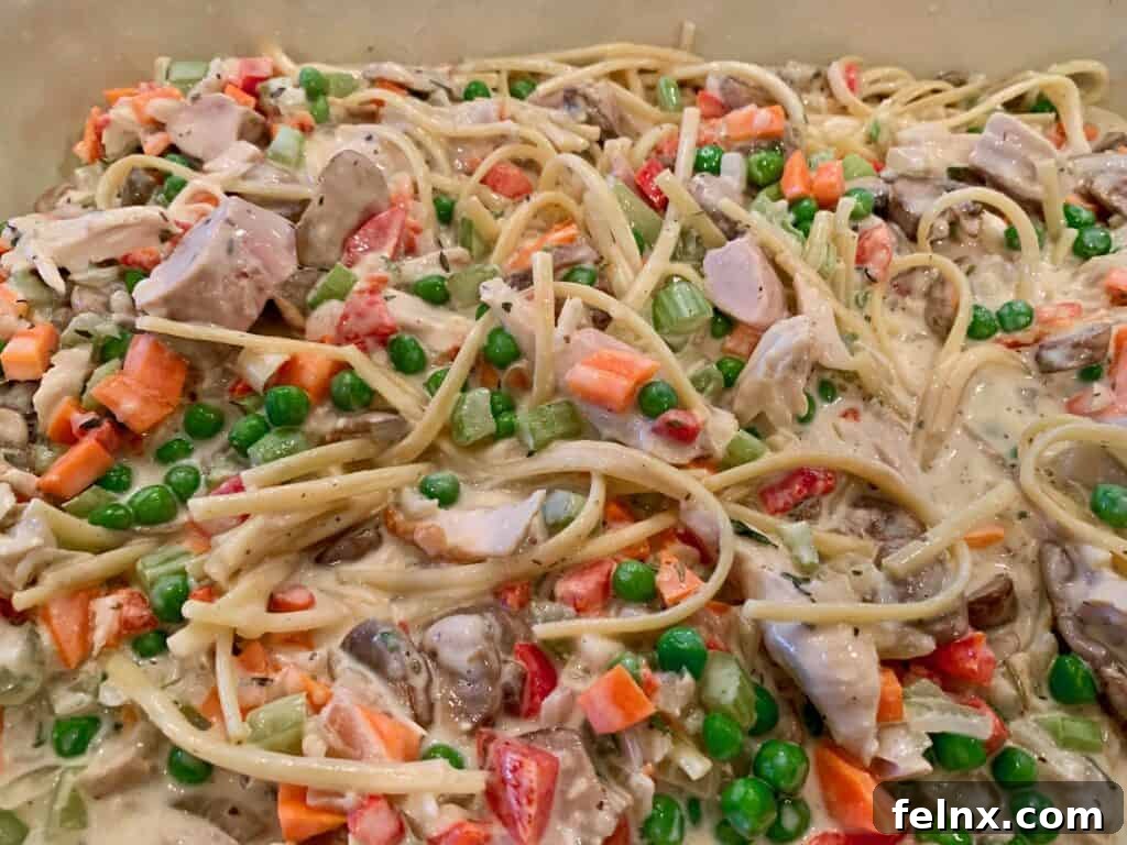 Transferring tetrazzini to the baking dish
