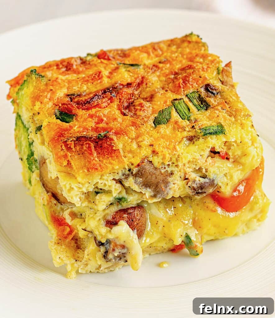 Serving a slice of Cheesy Italian Breakfast Casserole