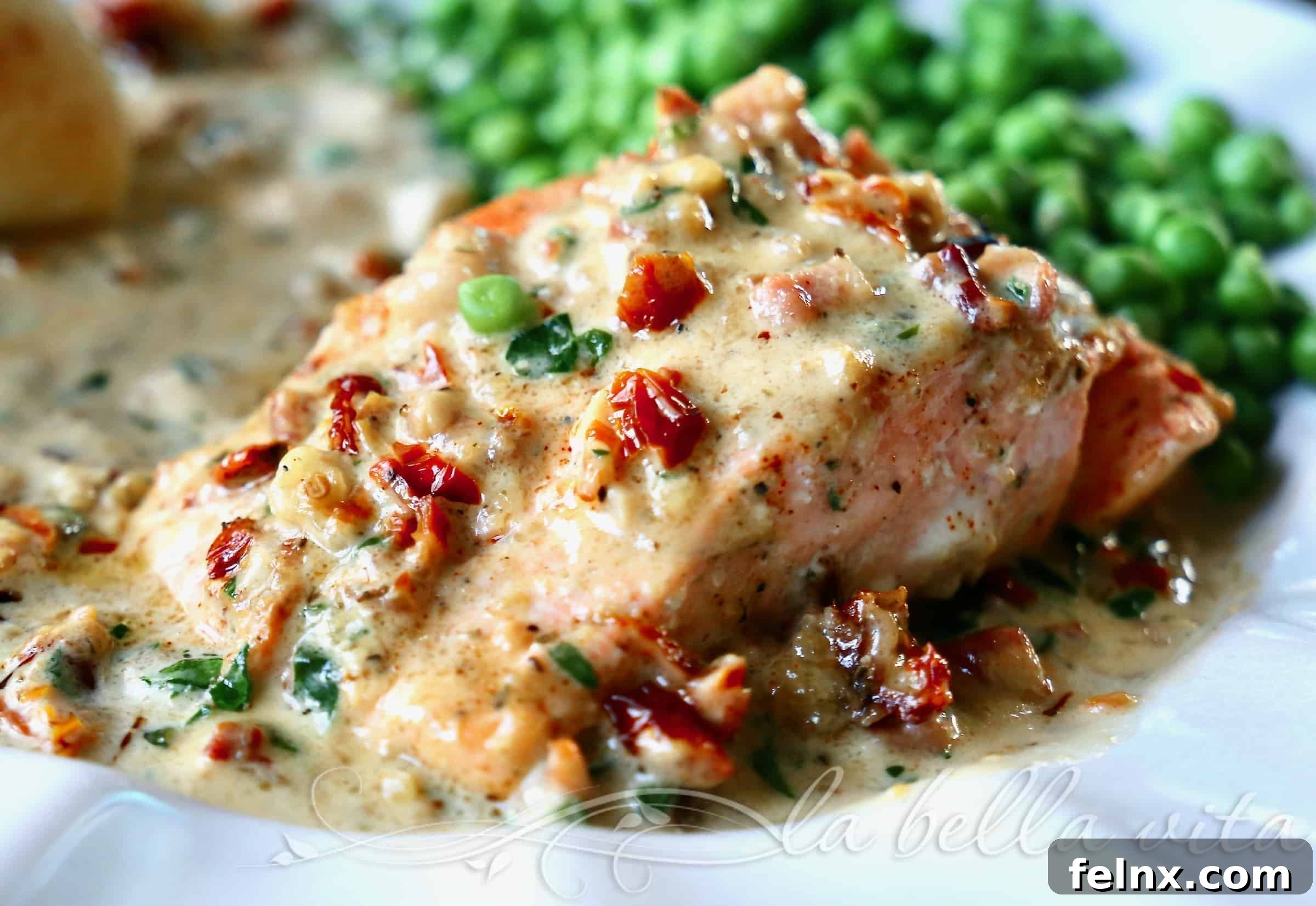 Tuscan Salmon simmering in a skillet