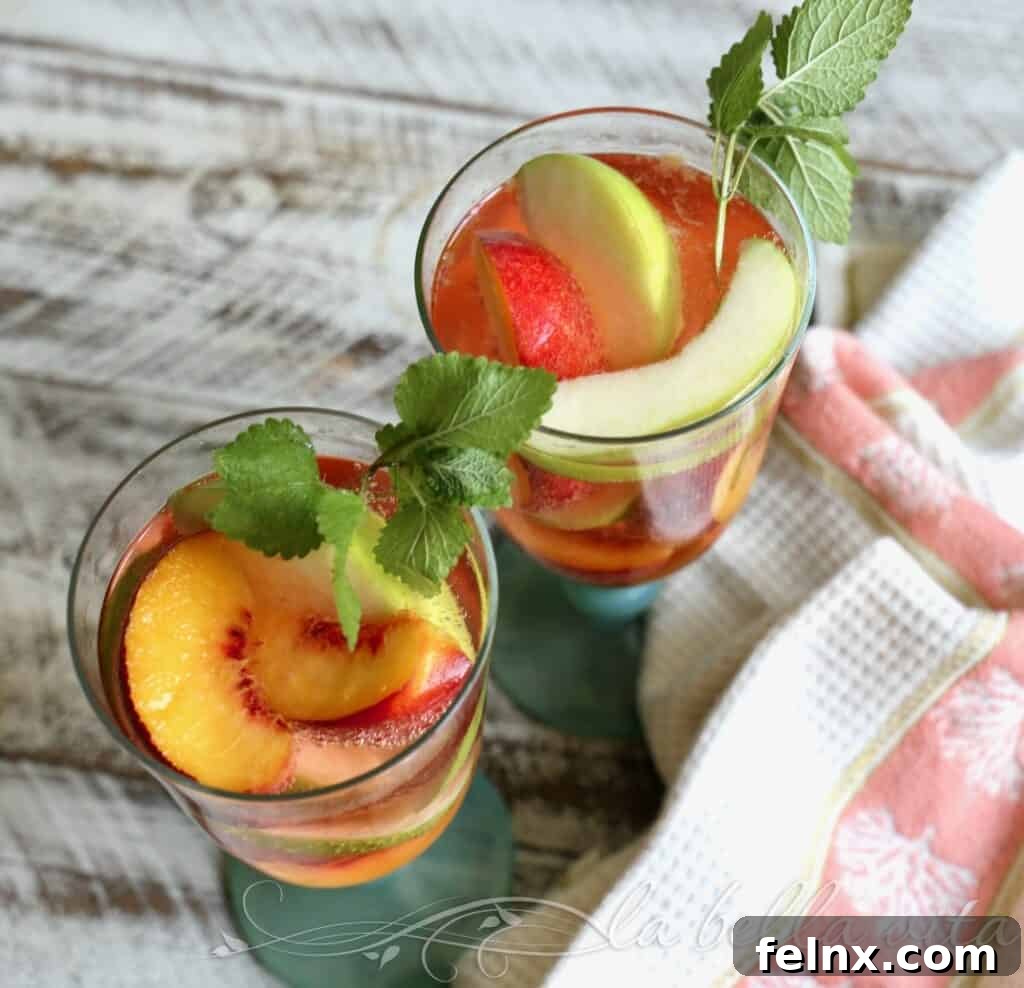 Pouring Southern Peach Sangria into a chilled glass