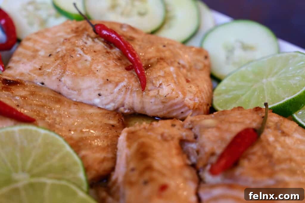 Fresh salmon fillets marinating in Thai aromatics