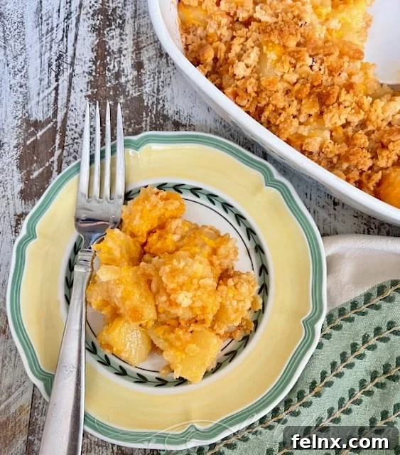 Ingredients for pineapple casserole including cheese and pineapple