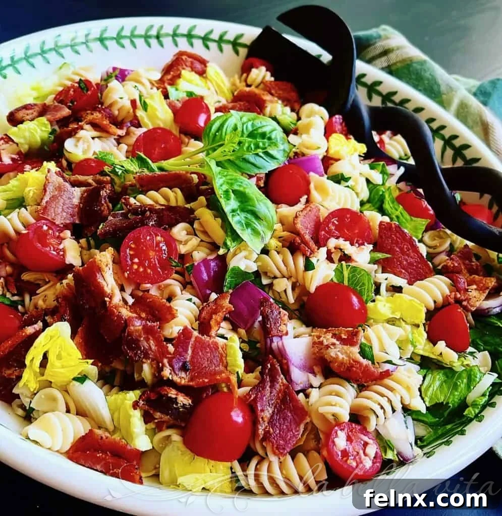 Fresh ingredients for BLT Pasta Salad featuring bacon, tomatoes, and greens