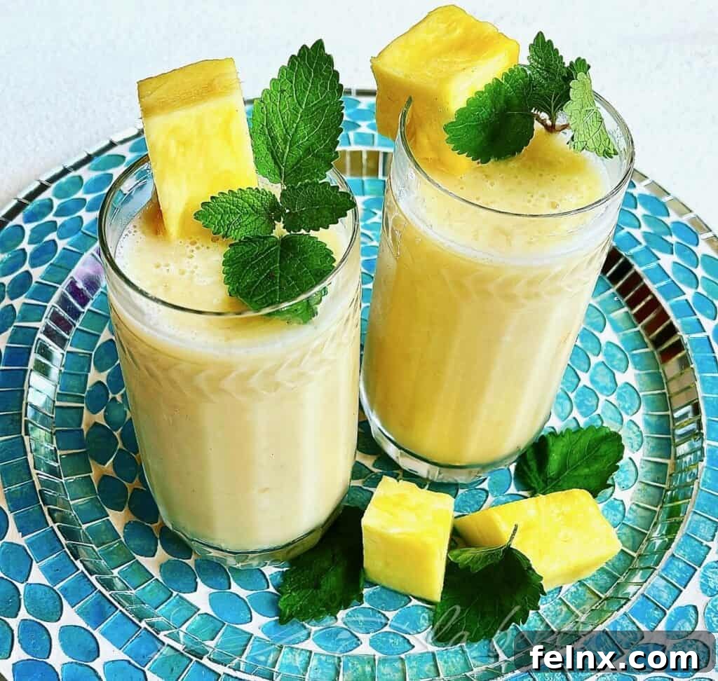 Tropical Pineapple, Coconut, Banana Smoothie with Rambutan in a glass