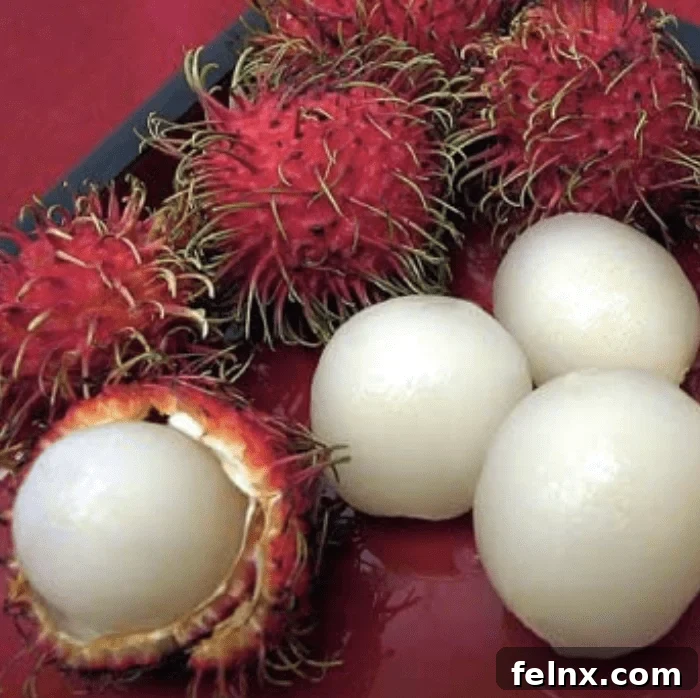 Fresh Rambutan fruit showing the hairy red skin