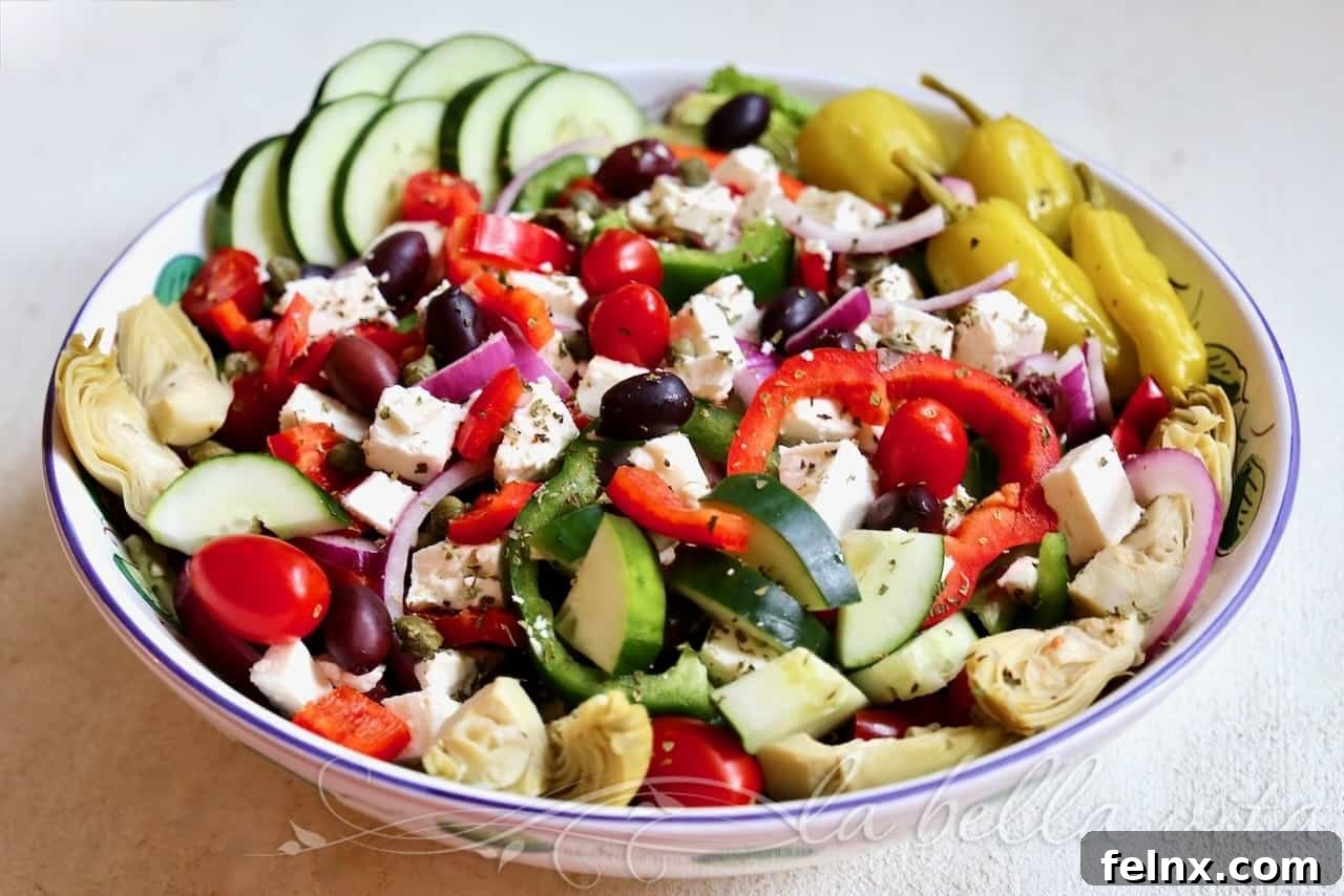 Fresh ingredients for a Mediterranean Greek salad including cucumbers and peppers