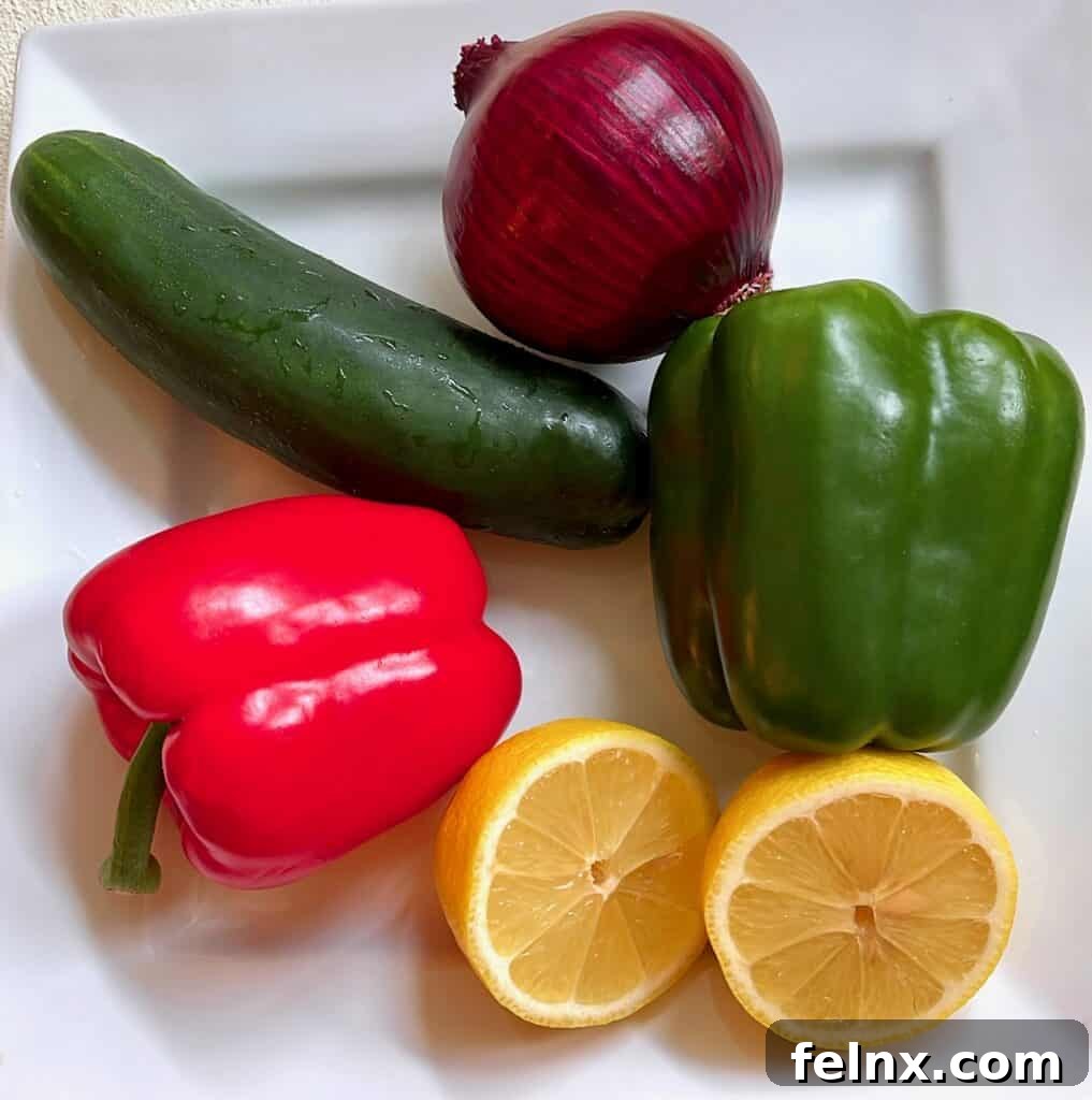 Assorted vegetables for Greek salad including red onion and lemons
