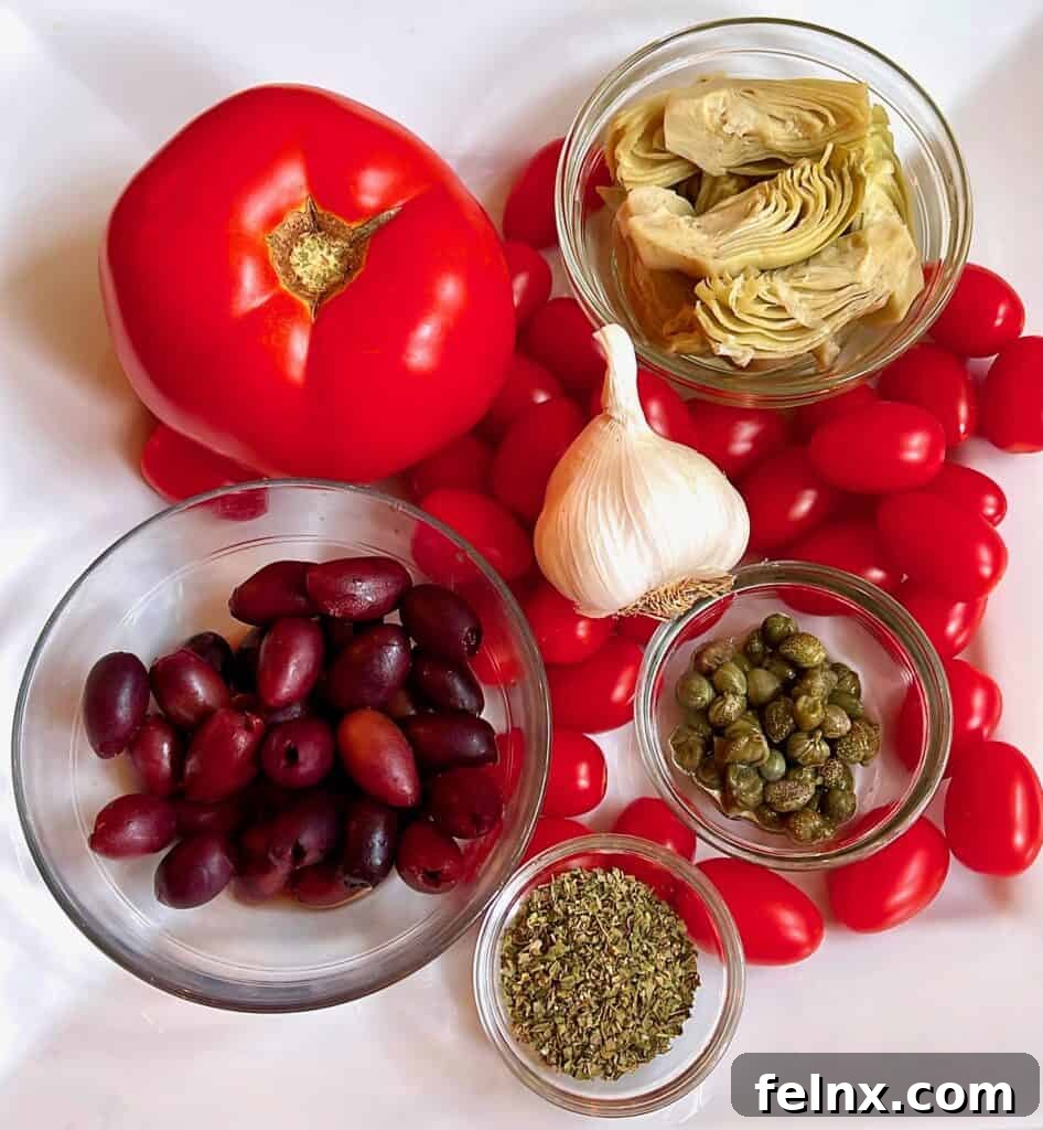 Detailed view of tomatoes, artichokes, and olives for the salad