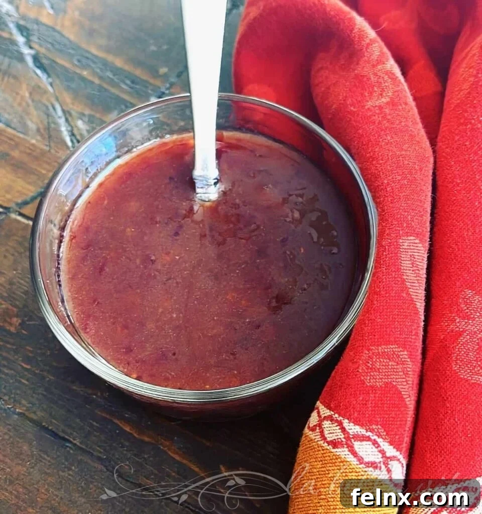 Glass jar containing Cranberry Balsamic Vinaigrette