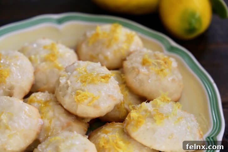 Close-up of glazed lemon ricotta cookies with zest