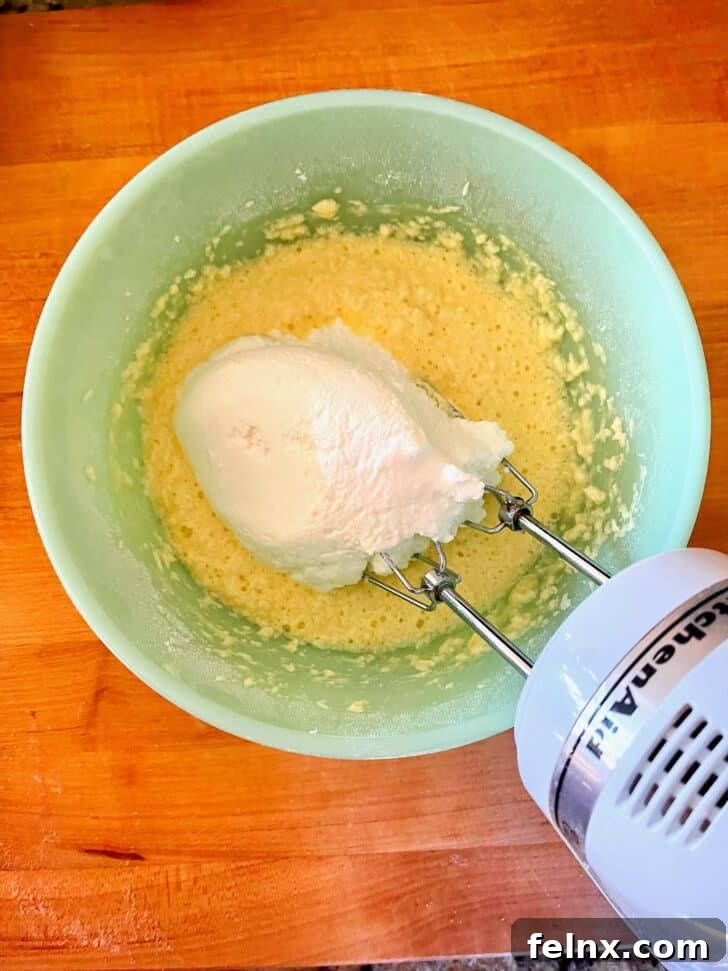 Adding ricotta cheese to the mixture