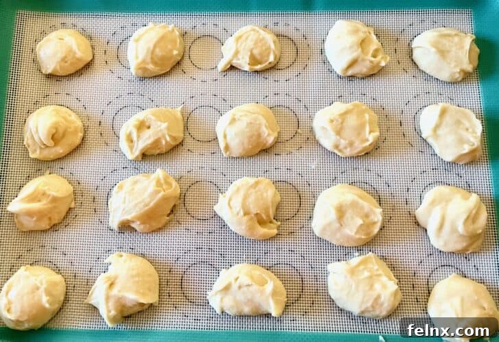 Scooping cookie dough onto a baking sheet