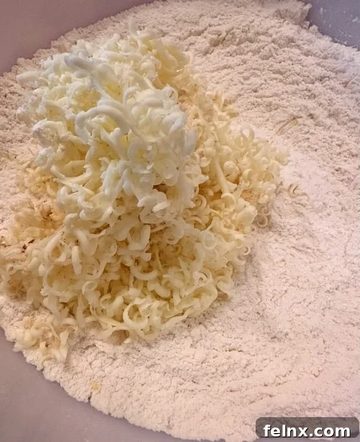 Adding butter to the flour mixture