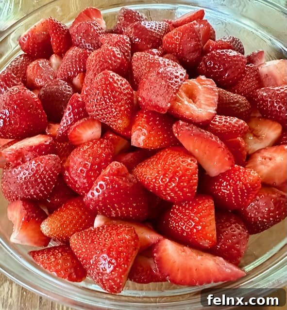 Fresh strawberries being cut