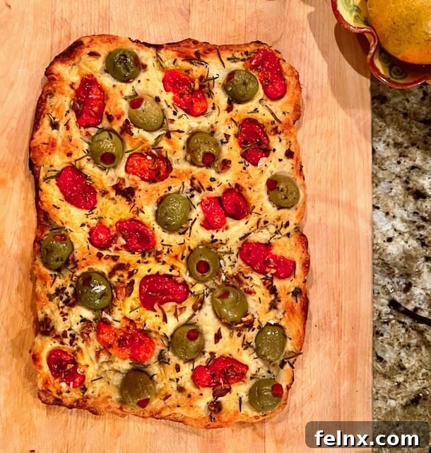 Delicious Italian Potato Focaccia Barese with tomatoes and olives