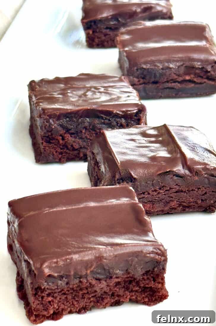 The finished brownies with a thick layer of set ganache