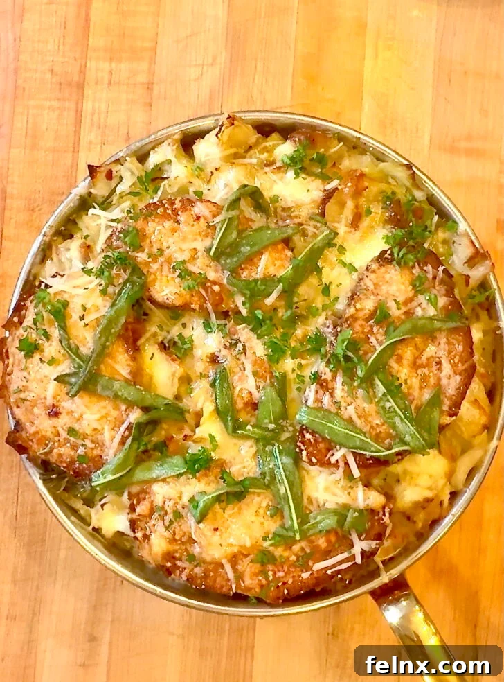 A steaming bowl of Italian Cabbage Soup with melted cheese