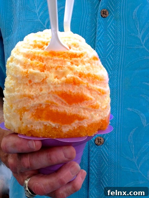 Close-up of Mango, Guava, and Passion Fruit Shave Ice with Sweet Cream Drizzle
