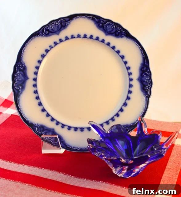 antique flow blue plate and murano glass